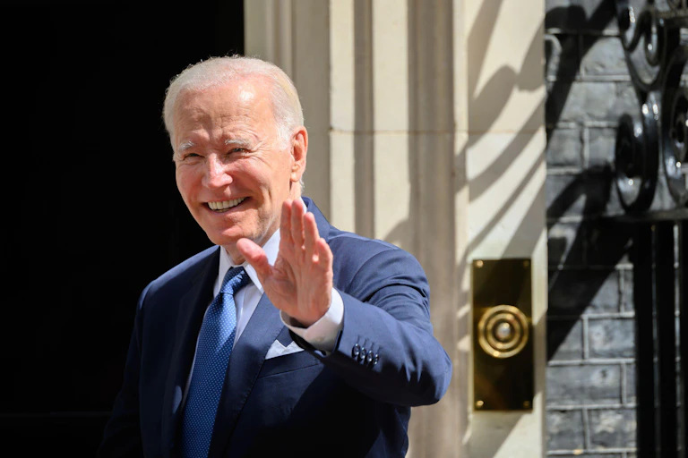 Joe Biden waving next to No 10 Downing Street.