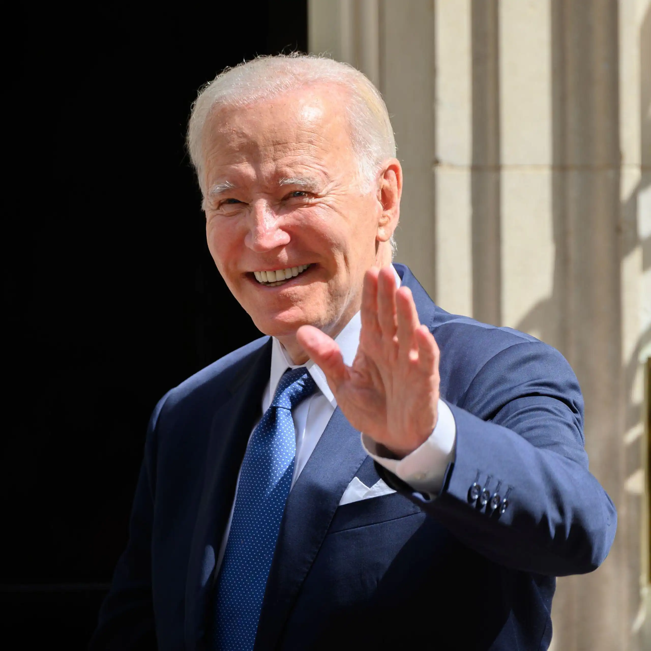 Joe Biden waving next to No 10 Downing Street.