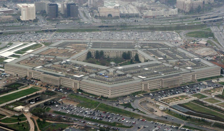 An overview of a large five-sided office building.