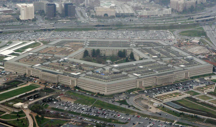 An overview of a large five-sided office building.