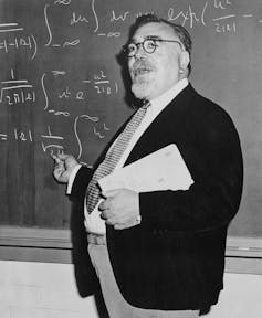 Norbert Wiener teaching at a blackboard