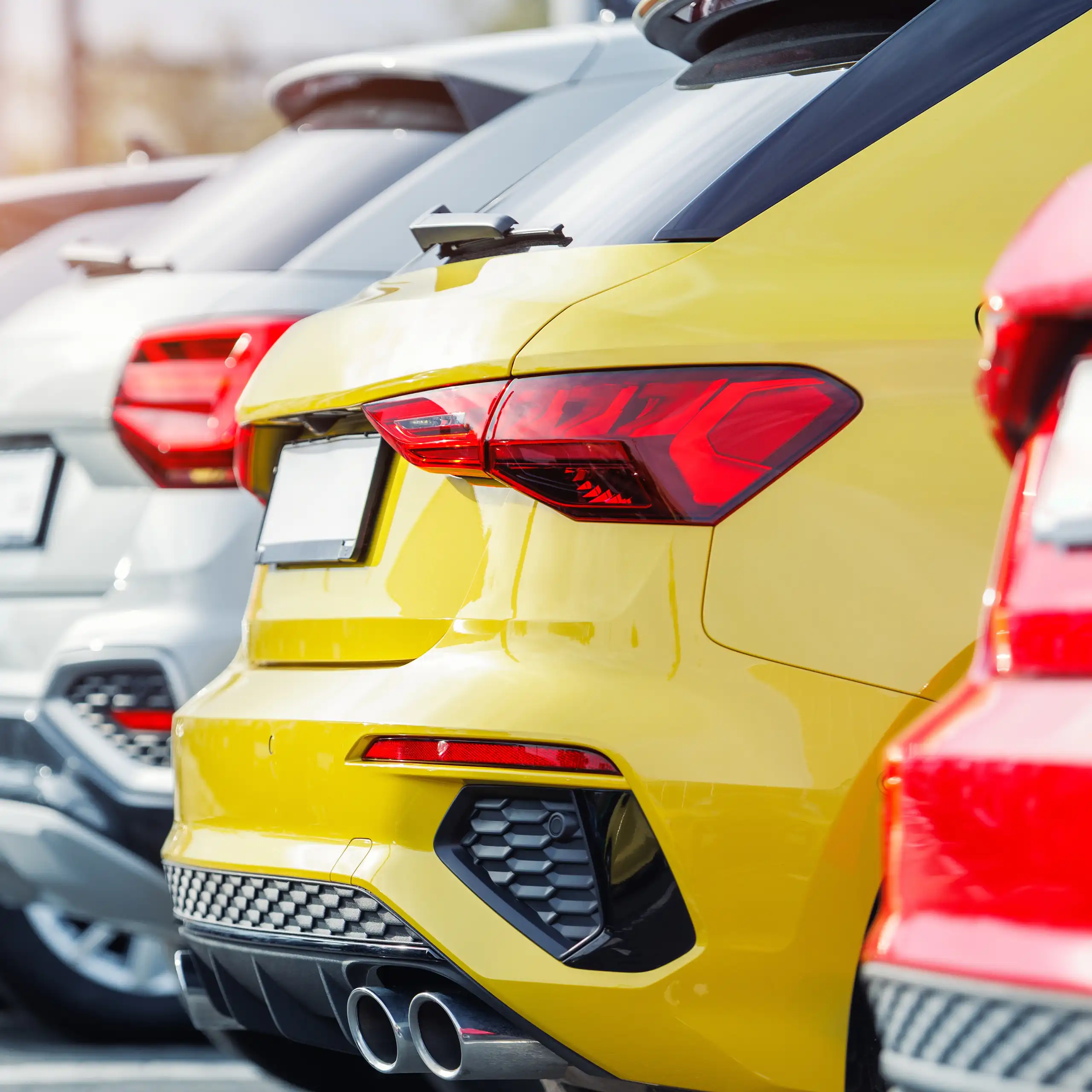 new cars lined up at a dealership