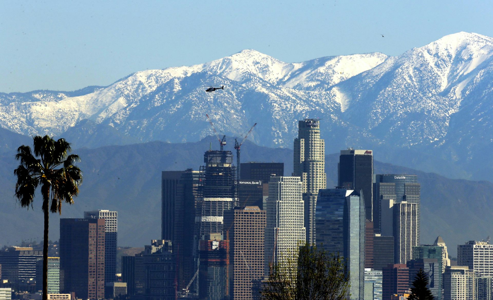 mountains against city skyline