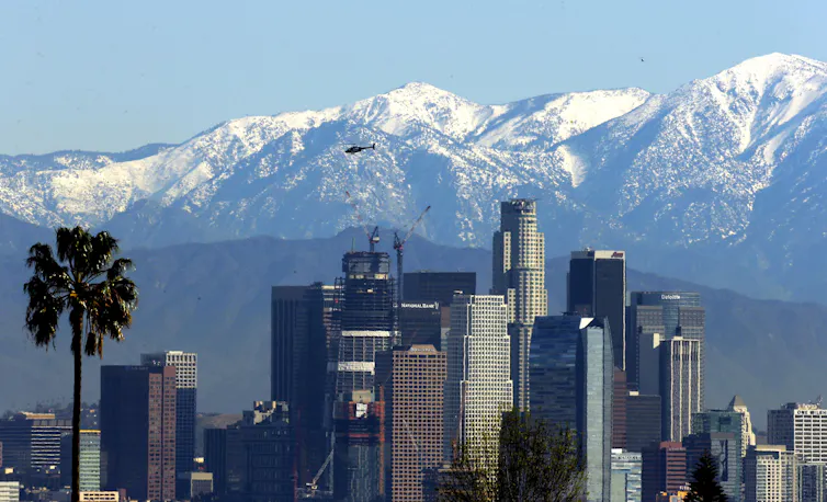 mountains against city skyline