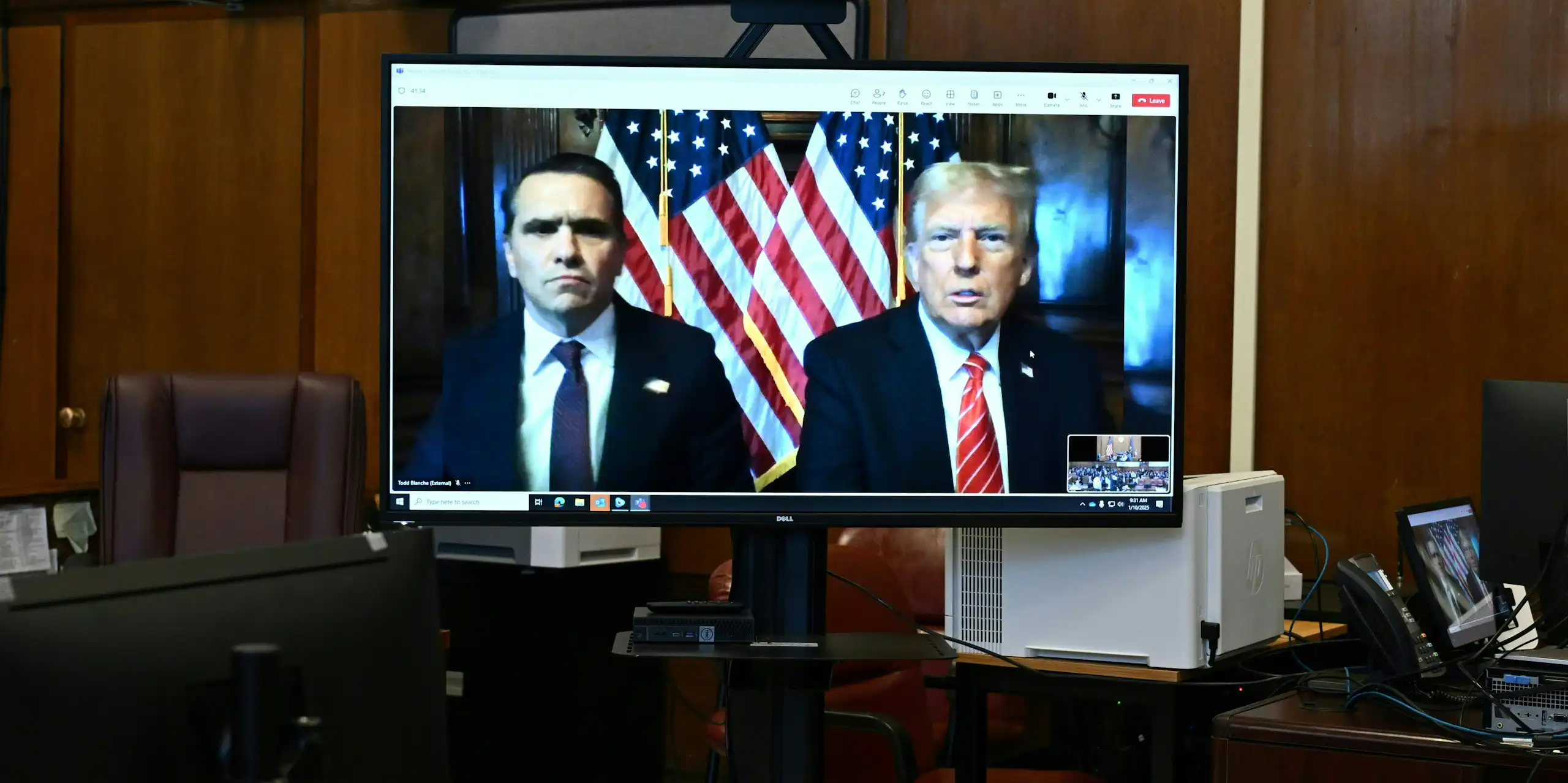 Donald Trump, and his attorney Todd Blanche appear on a screen remotely for a sentencing hearing.