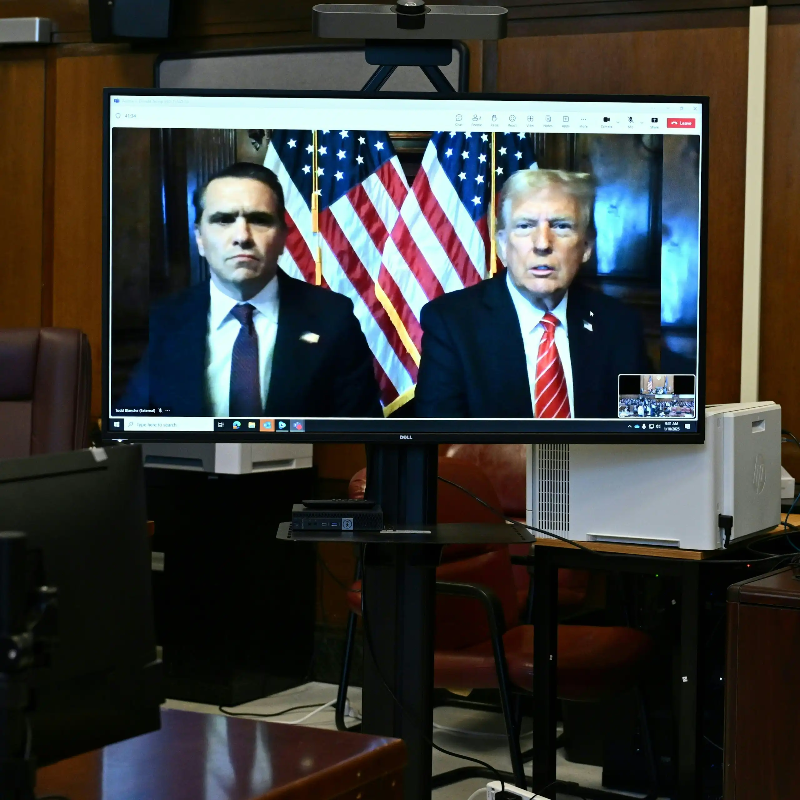 Donald Trump, and his attorney Todd Blanche appear on a screen remotely for a sentencing hearing.