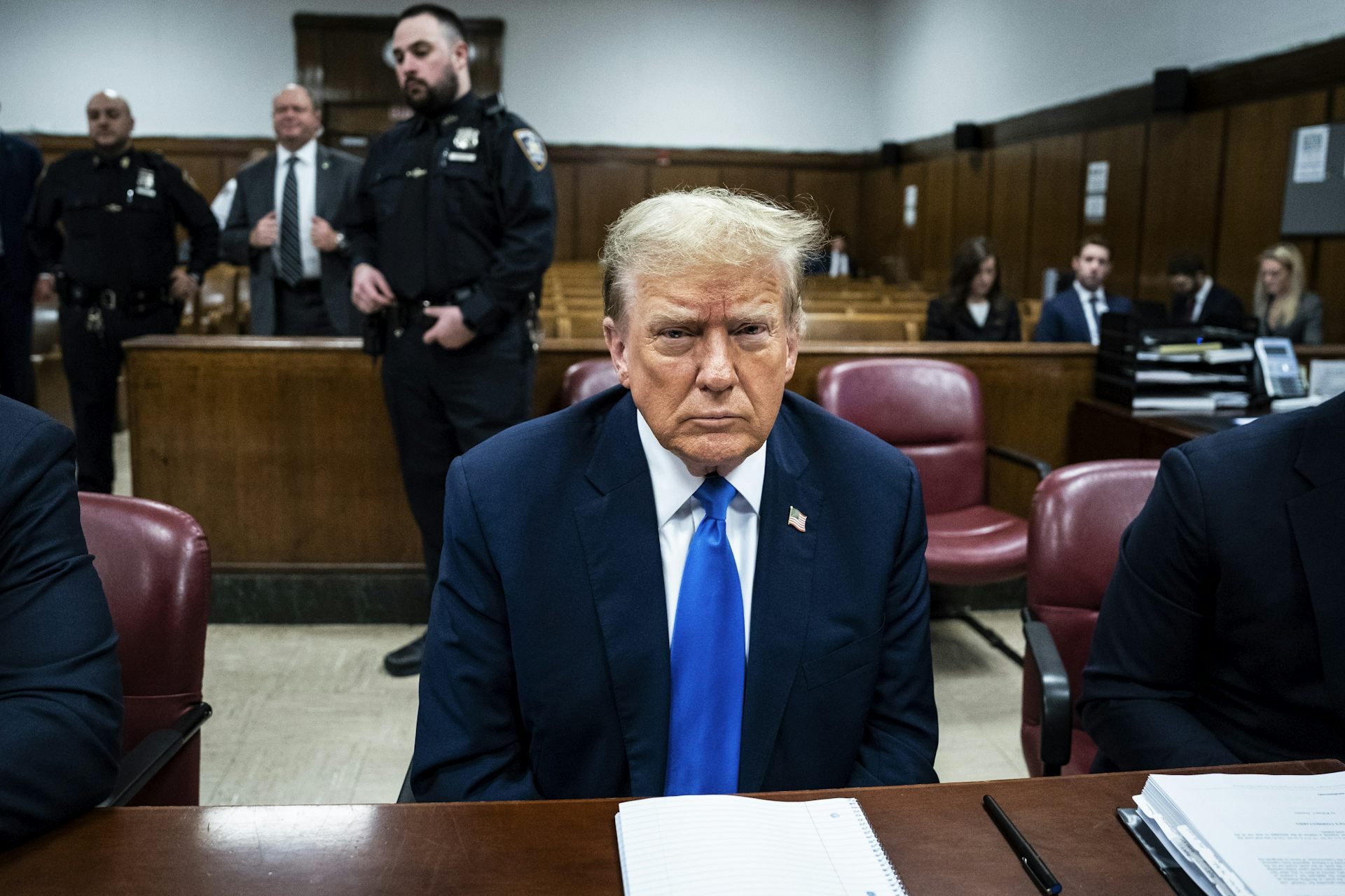Donald Trump sat in a courtroom.