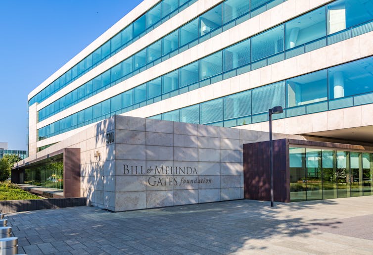 The headquarters of the Bill and Melinda Gates Foundation is a big building with a lot of windows.