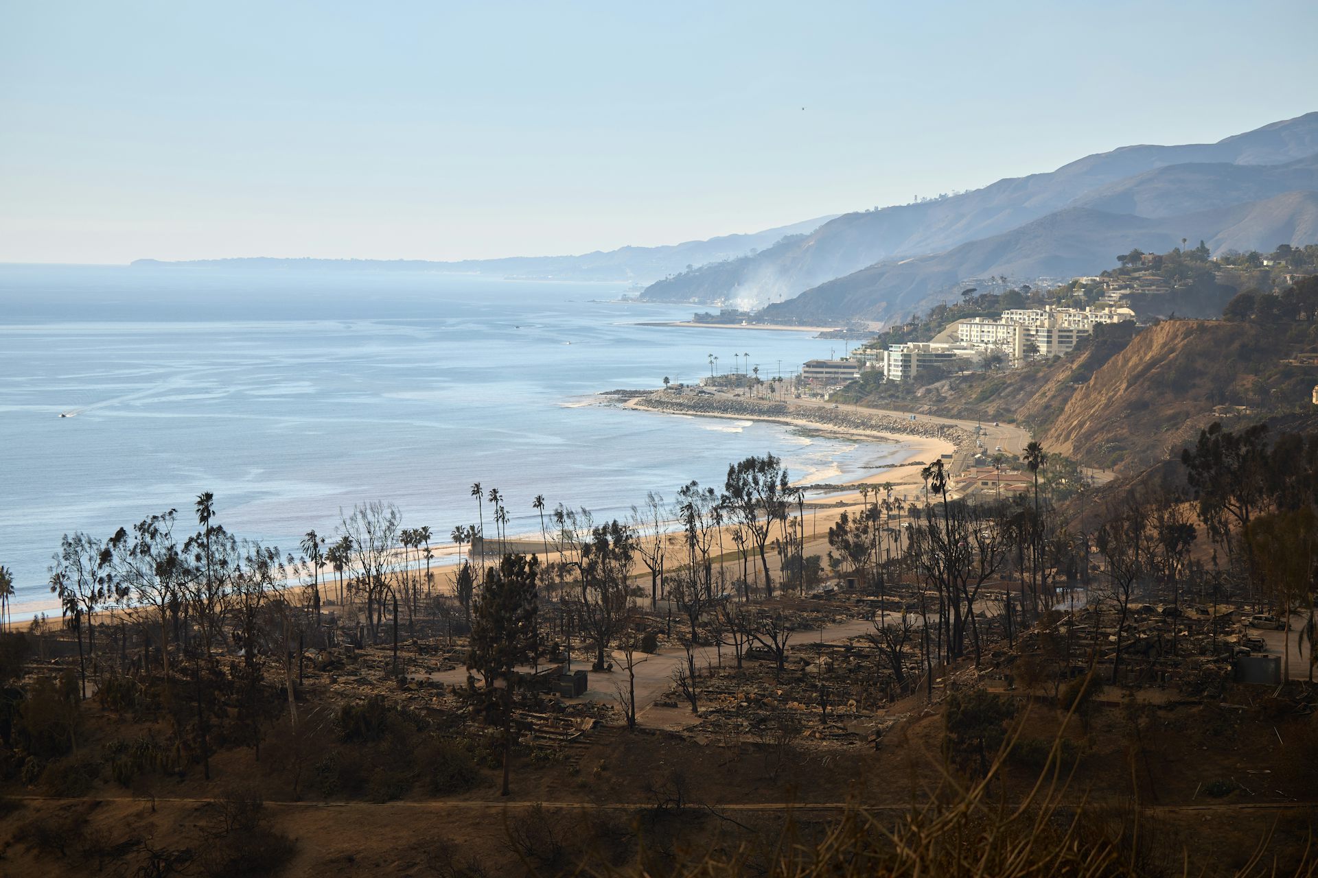 A view of the remains of homes destroyed by the Palisades wildfire in the Pacific Palisades neighborhood of Los Angeles