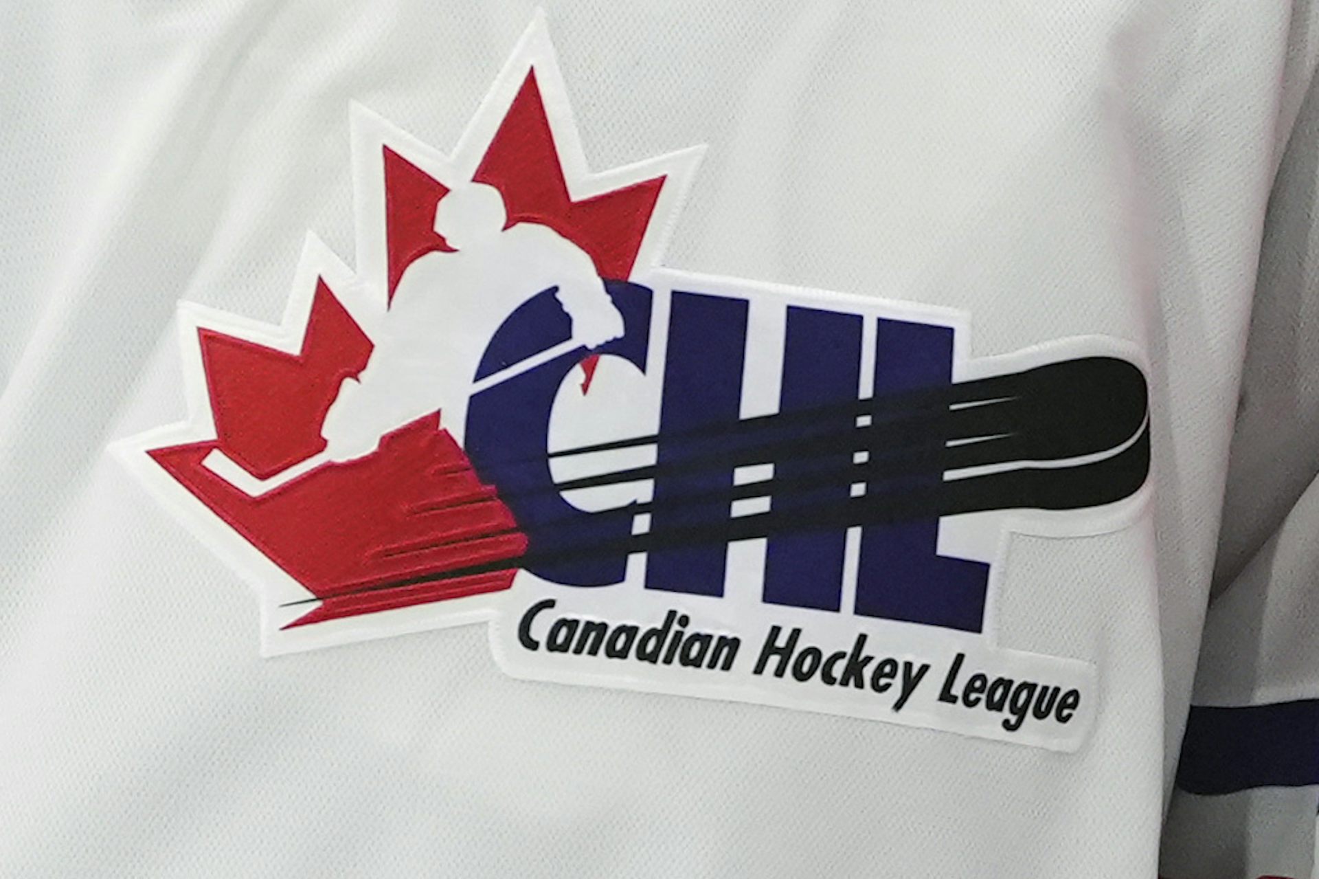Close up of a hockey jersey that says 'CHL Canadian Hockey League' on it