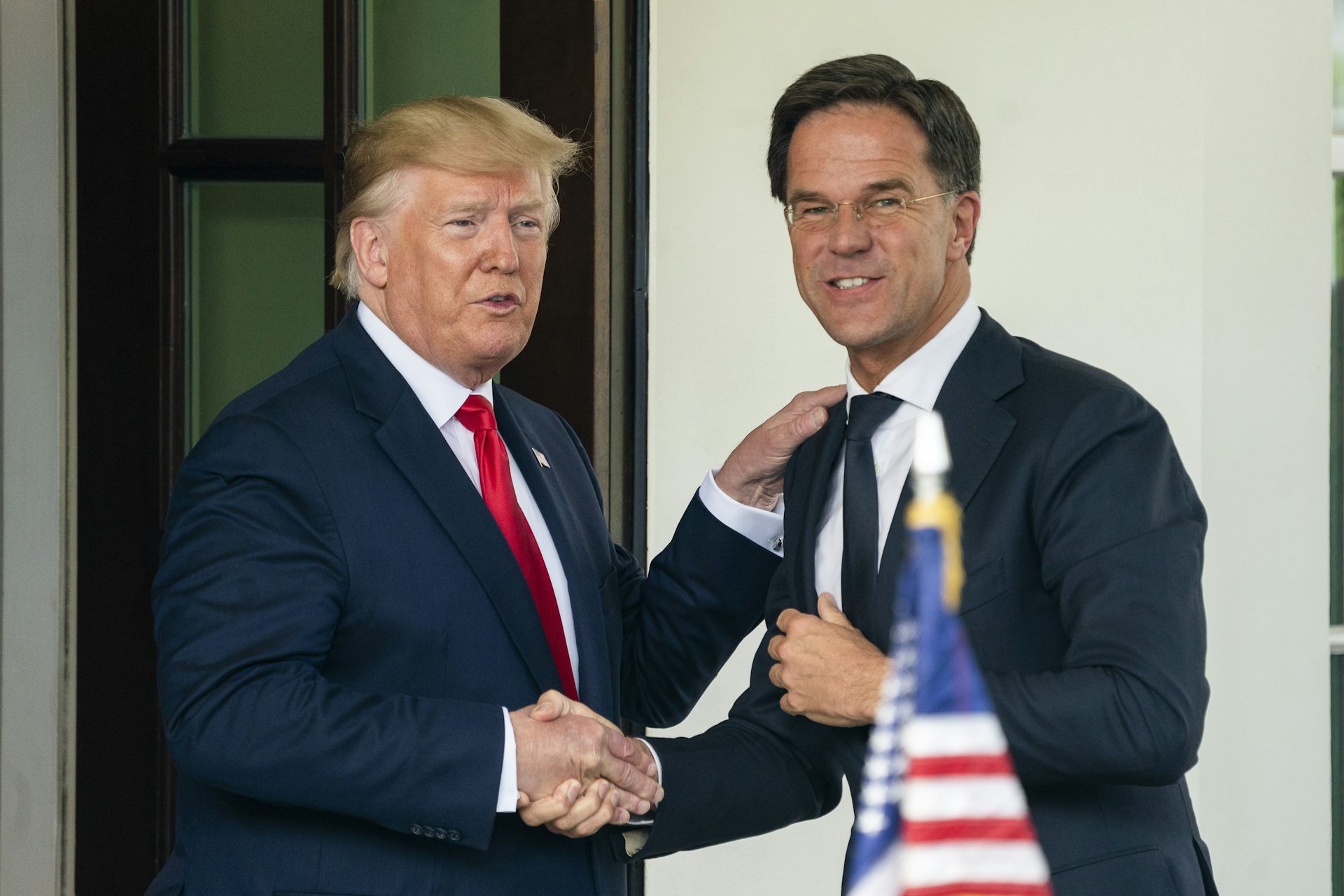 Donald Trump and Nato secretary-general Mark Rutte shaking hands in 2019.
