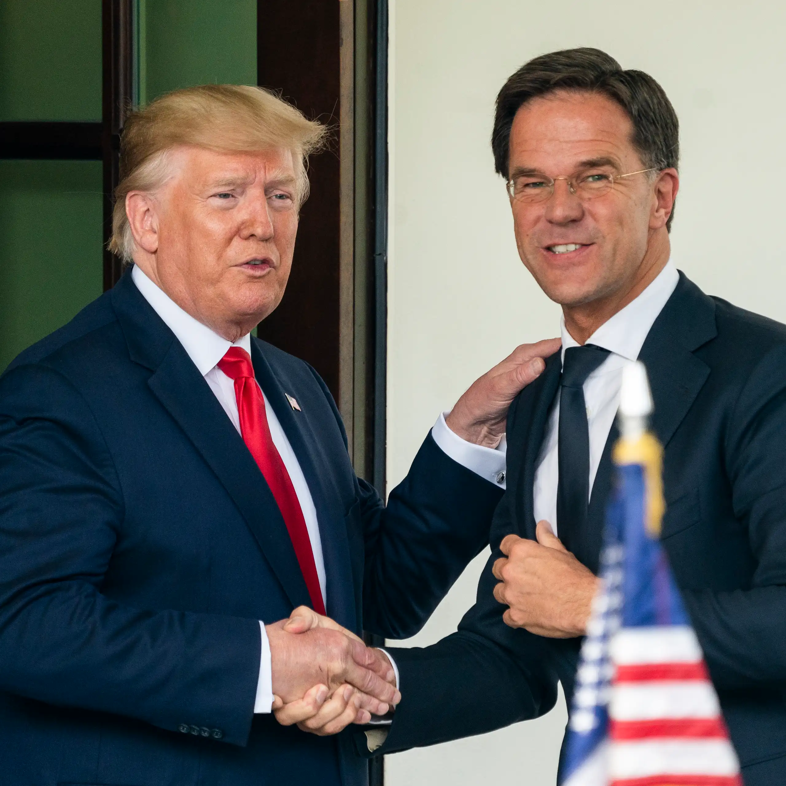 Donald Trump and Nato secretary-general Mark Rutte shaking hands in 2019.