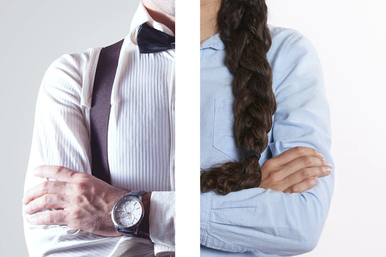 Half the upper body of a man and half the upper body of a woman, next to each other.