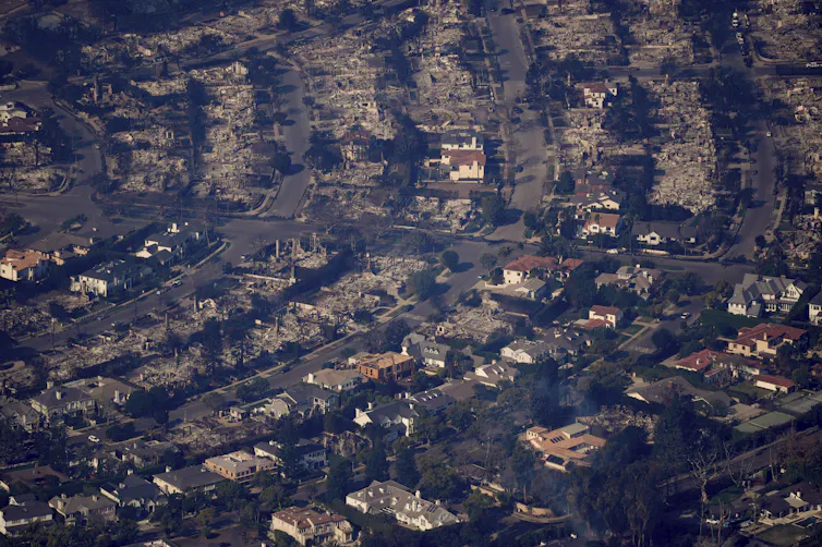 an aerial view of a burned-out neighbourhood