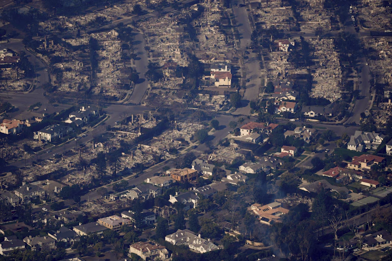 a birds-eye view of a burned out neighbourhood