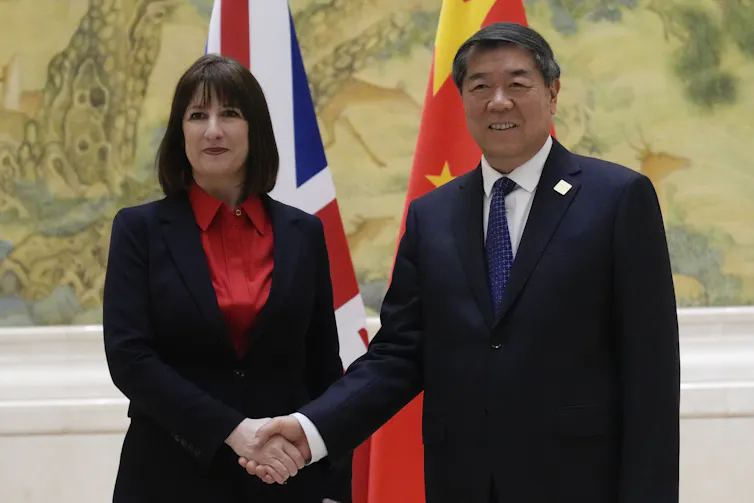 UK Chancellor of the Exchequer Rachel Reeves shakes hands with Chinese Vice Premier He Lifeng.