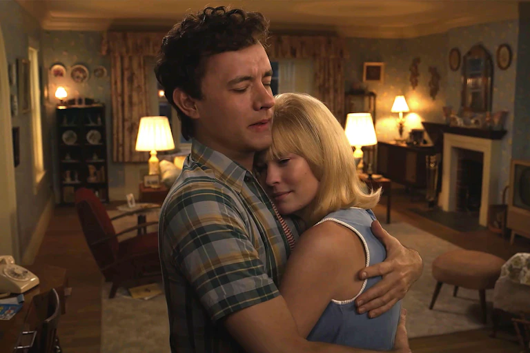 A digitally de-aged Tom Hanks and Robin Wright dancing in a living room.
