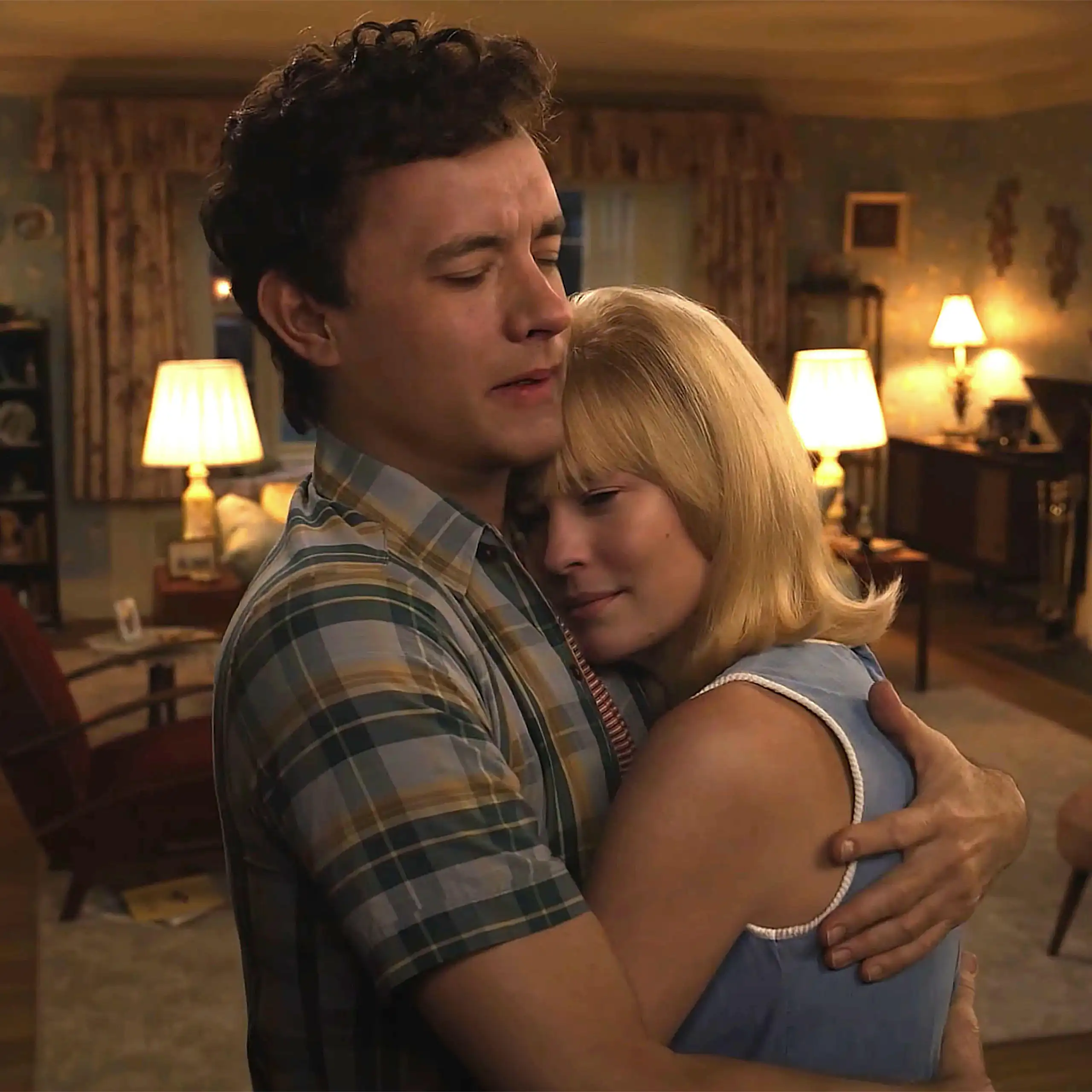 A digitally de-aged Tom Hanks and Robin Wright dancing in a living room.