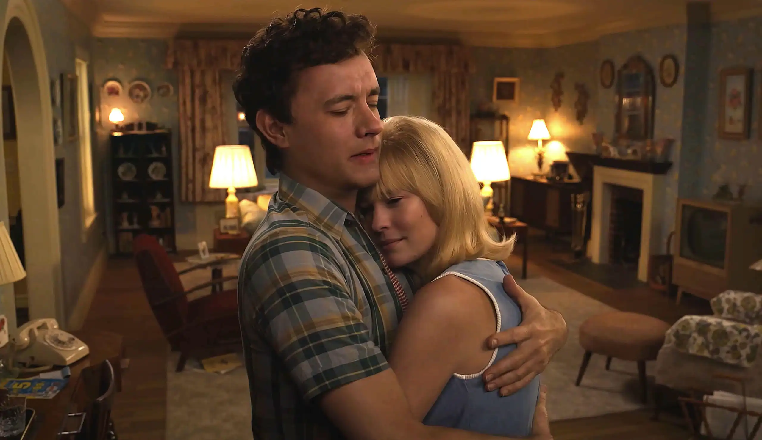 A digitally de-aged Tom Hanks and Robin Wright dancing in a living room.