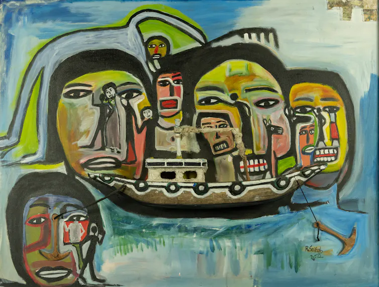 A painting featuring seven faces drawn in a crude style and a person stretched out on top of one side of them, a boat in the centre beneath their faces.