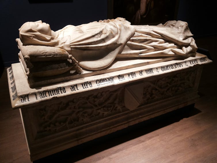 The name of the game of Aldonze de Mendosis, which is reflected in artwork 3 The tomb of Aldonze de Mendoza, with a woman's sculpture lying on the grave.