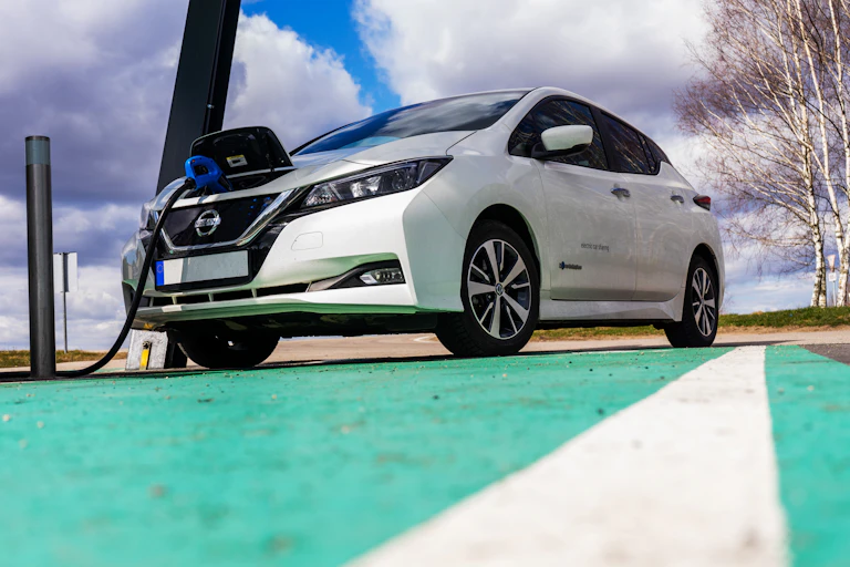 nissan ev plugged into a charging point