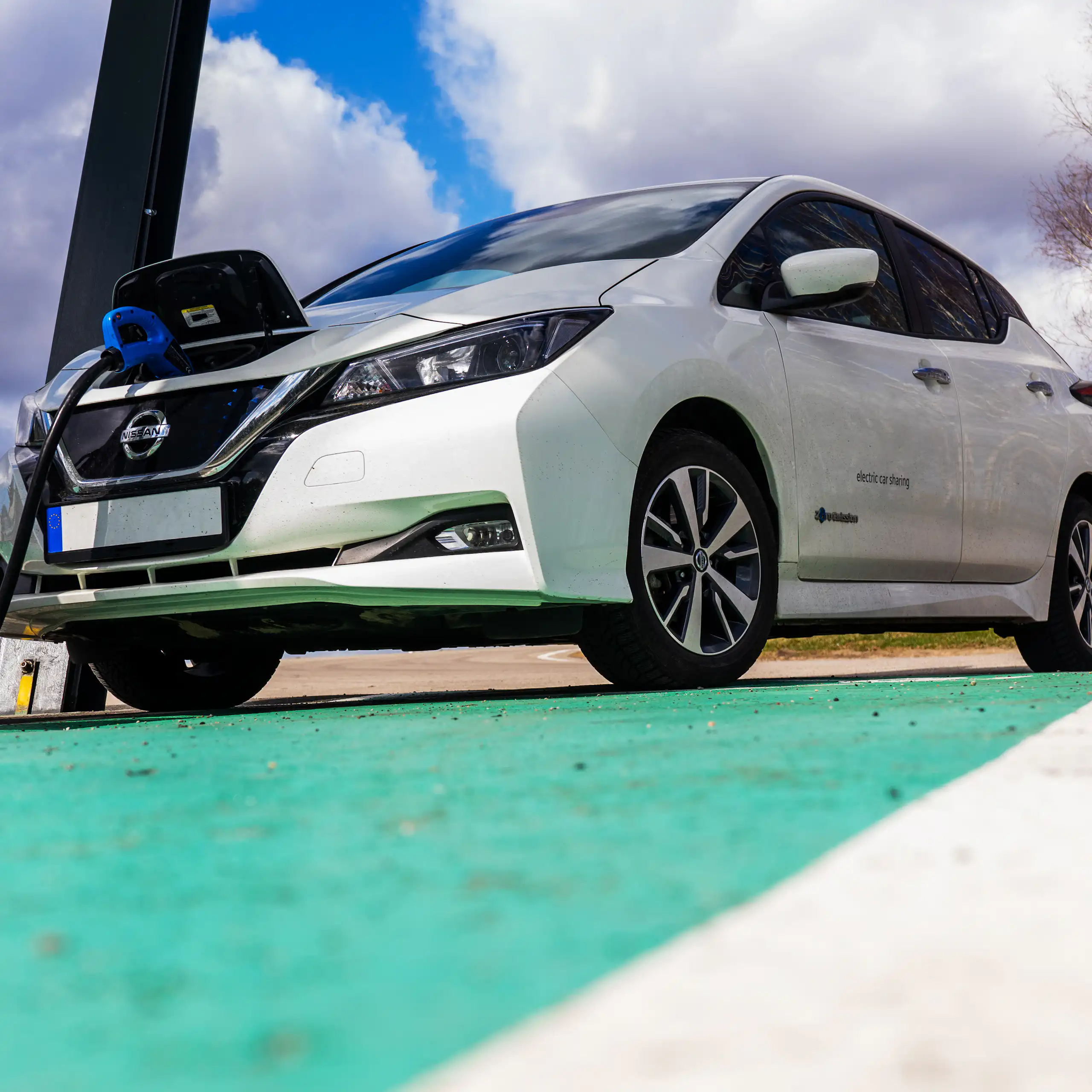 nissan ev plugged into a charging point