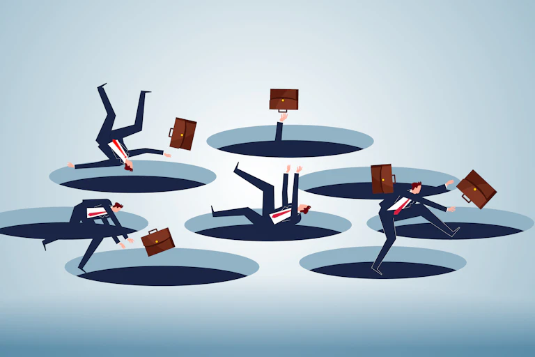 People in business suits fall into holes in the floor.