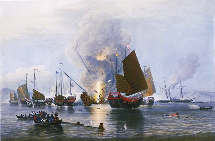 A painting of old warships with sails, one ship seen in the background sinking and on fire