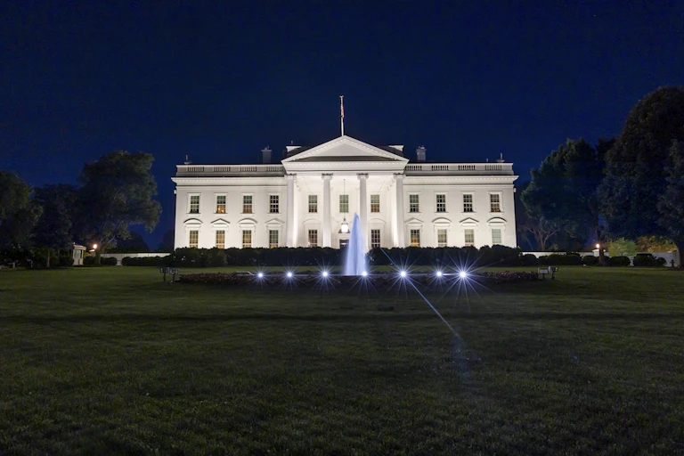 night view of illuminated White House with fountain