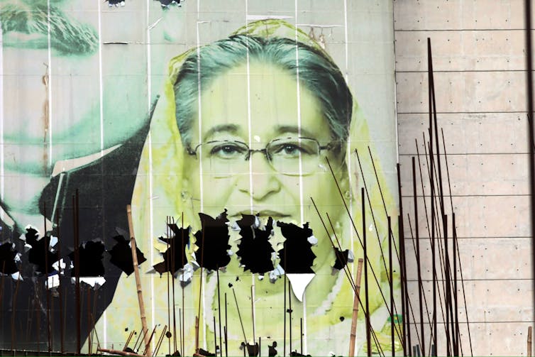 A vandalised poster of deposed Bangladesh prime minister, Sheikh Hasina, in the capital Dhaka.