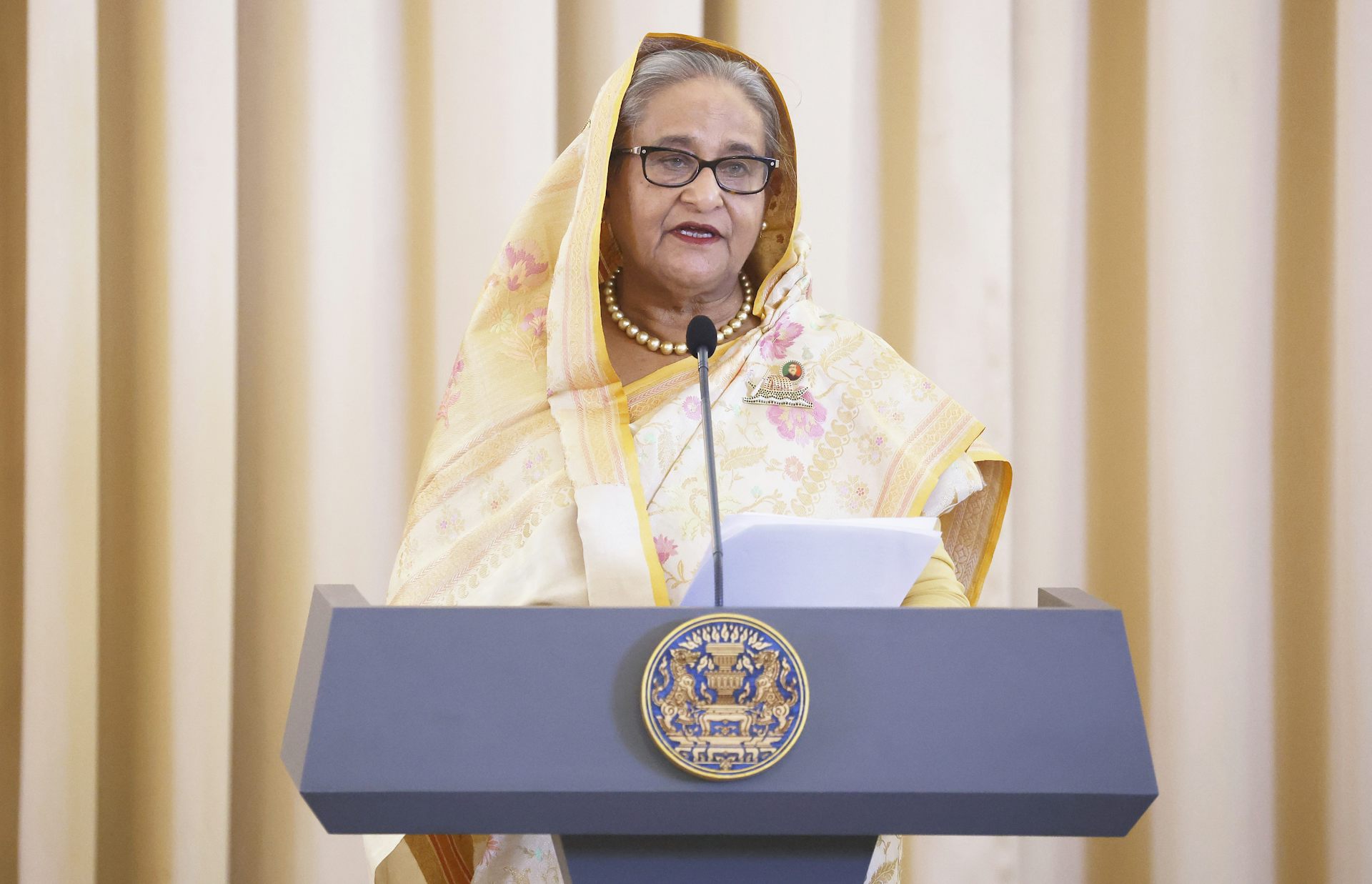 Bangladeshi prime minister, SHeikh Hasina, speaking at a lectuern in Thailand during a state visit in April 2024.