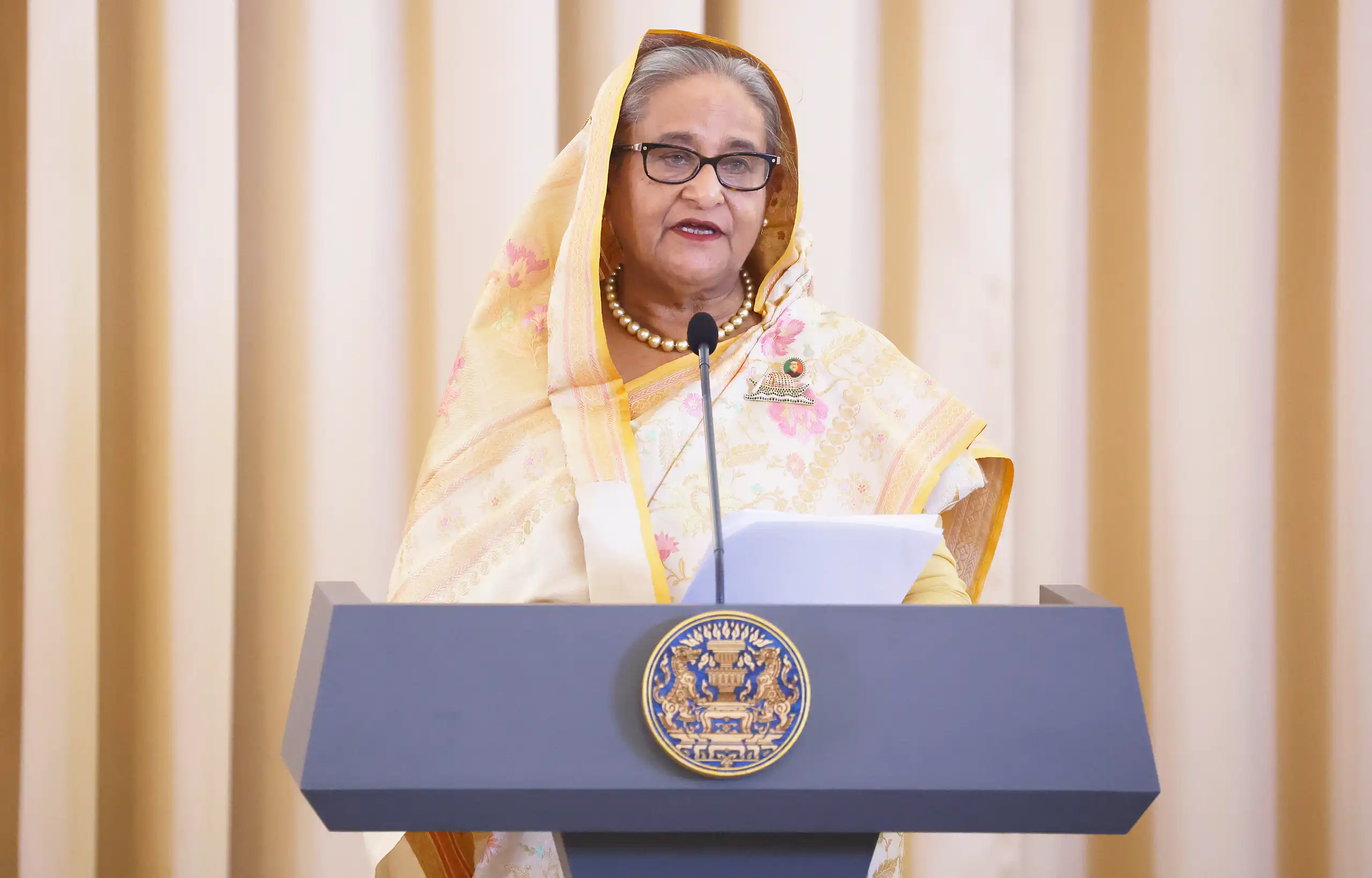 Bangladeshi prime minister, SHeikh Hasina, speaking at a lectuern in Thailand during a state visit in April 2024.