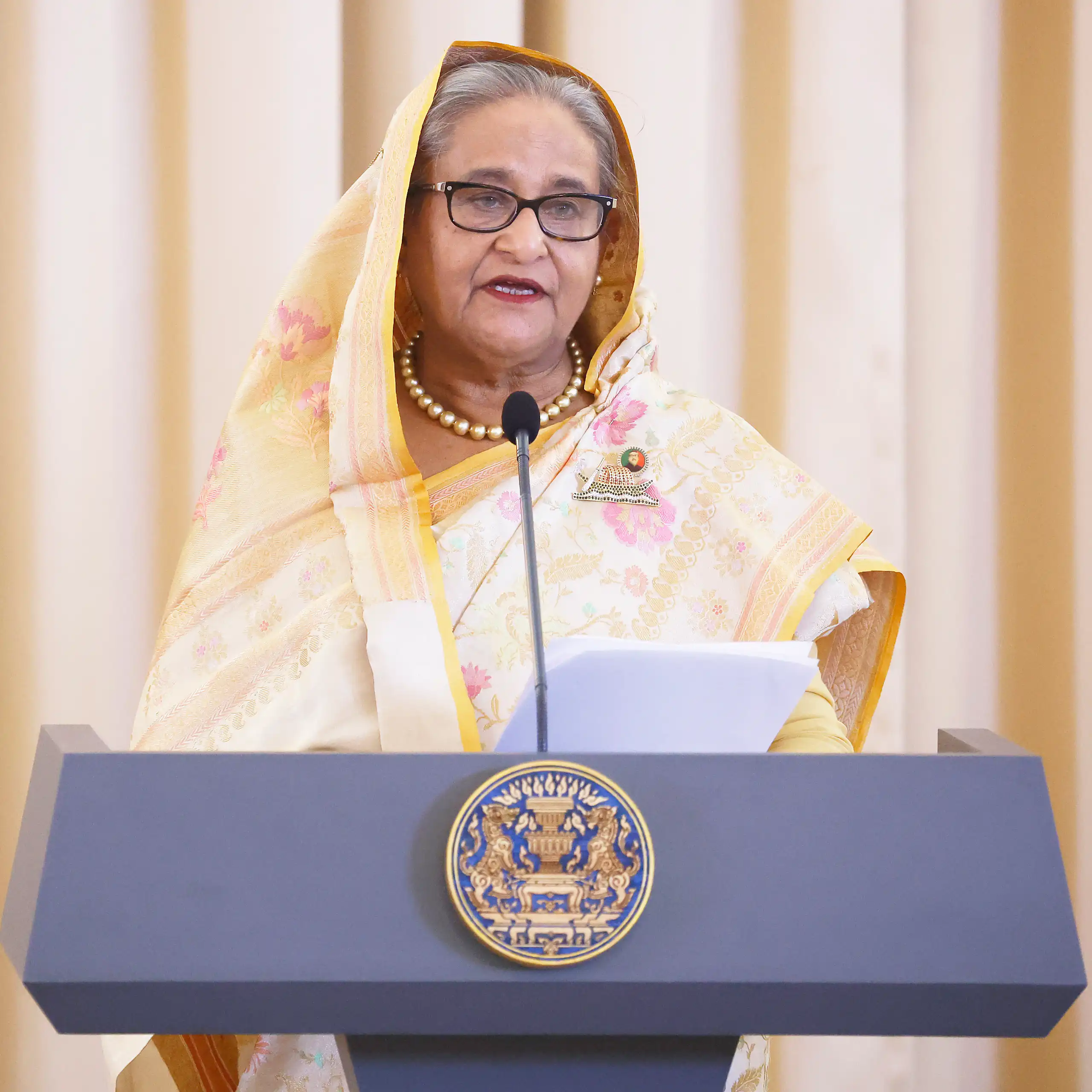 Bangladeshi prime minister, SHeikh Hasina, speaking at a lectuern in Thailand during a state visit in April 2024.