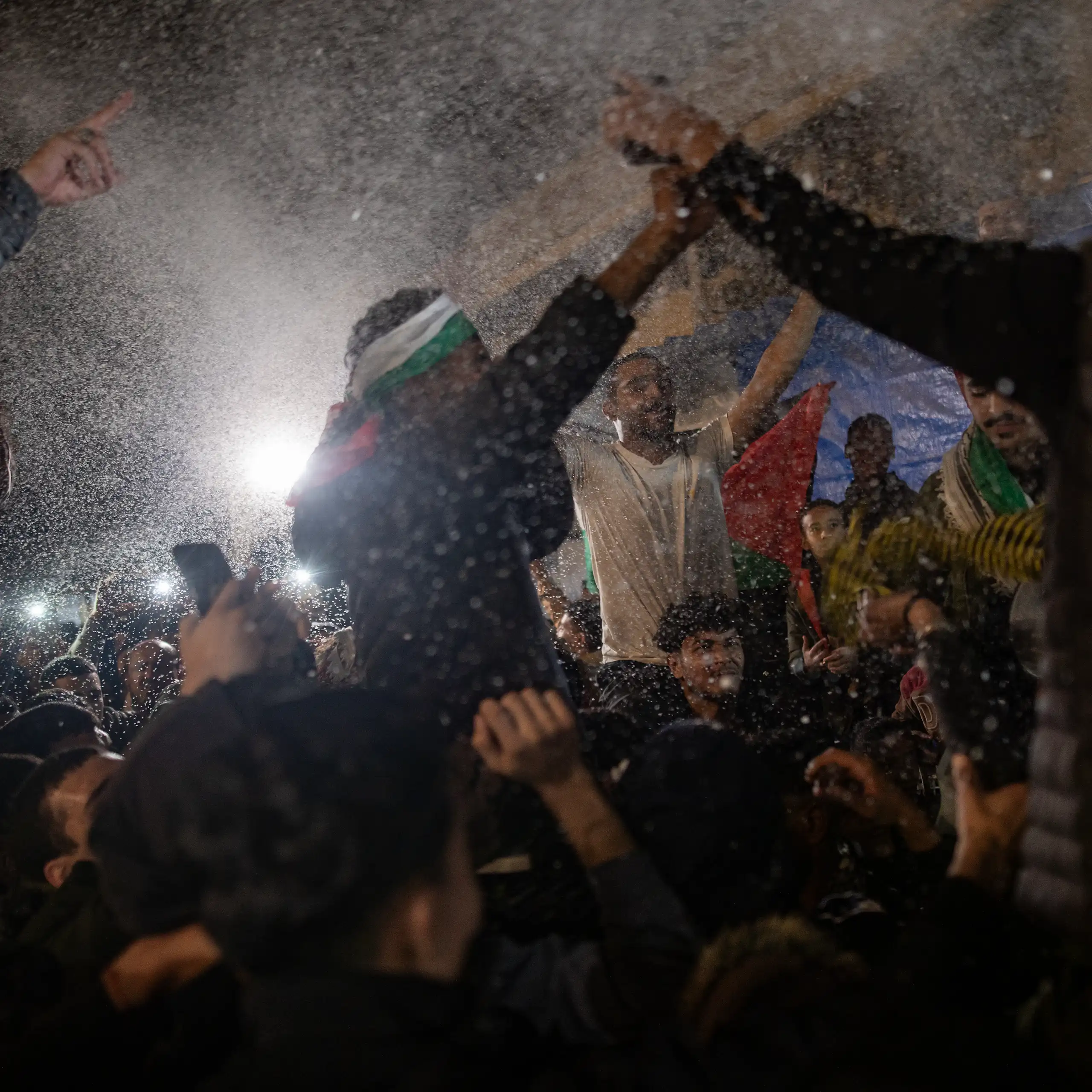 People in in Khan Younis, southern Gaza Strip, react to the news a ceasefire has been agreed.