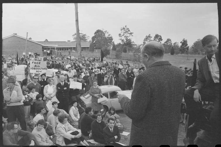 A man speaks to a crowd.