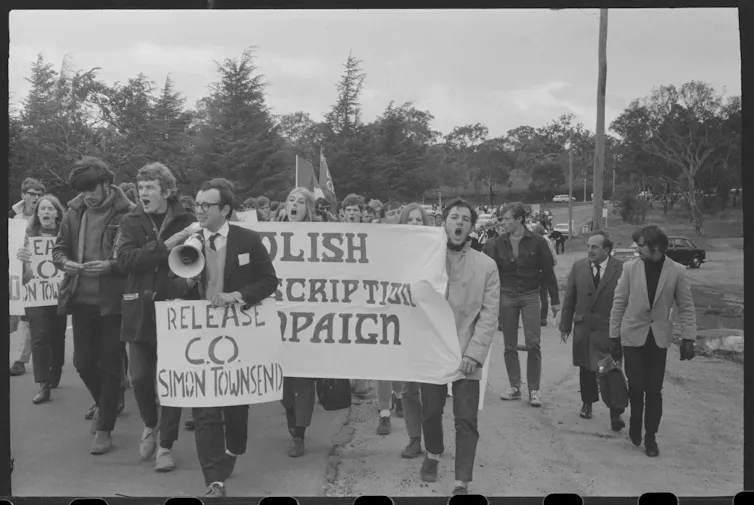 Protestors walk.