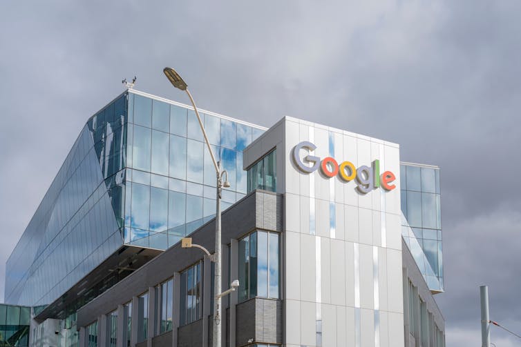 Glass building with 'Google' written in colourful letters.