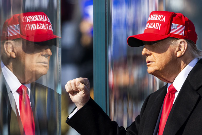 Donald Trump wearing a MAGA hat.