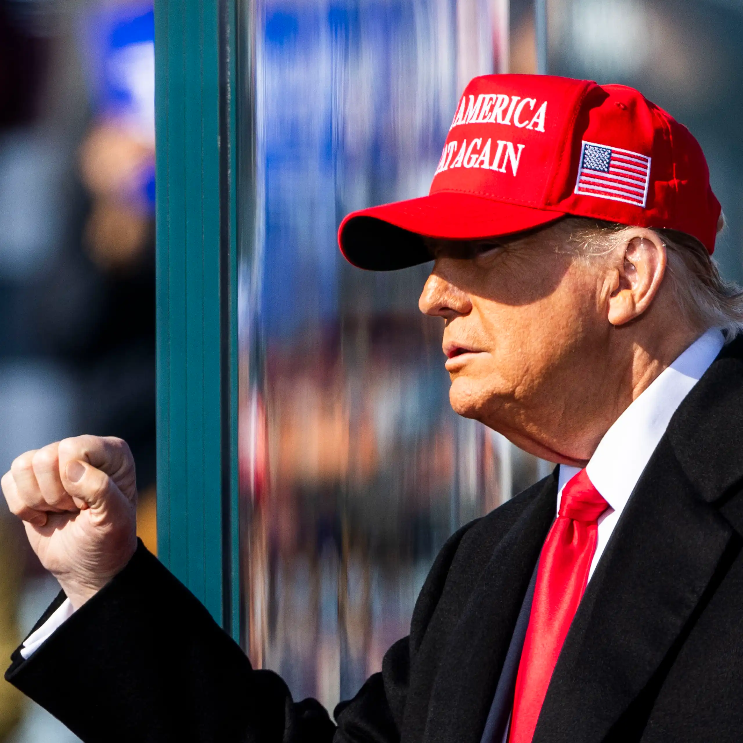 Donald Trump wearing a MAGA hat.