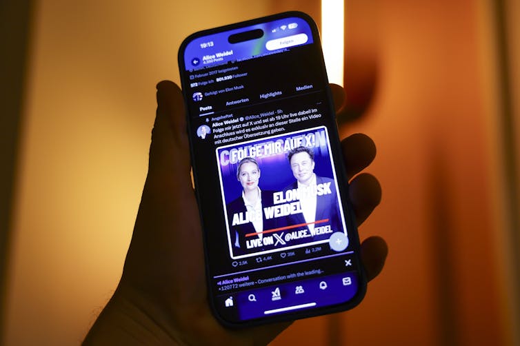 A phone showing an ad for Elon Musk's event with Alice Weidel.