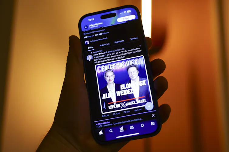 A phone showing an ad for Elon Musk's event with Alice Weidel.