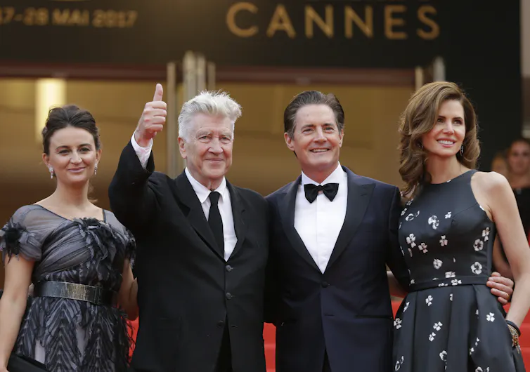 Four people on the red carpet