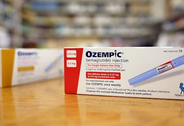 Two boxes of Ozempic, placed on a pharmacy counter.