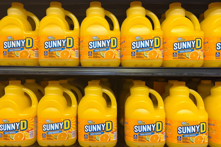 Bottles of Sunny D on a shop shelf.