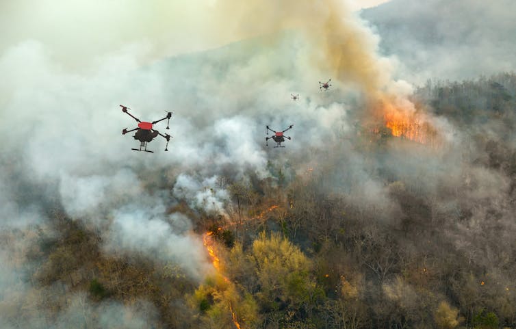 drones flying over a forest fire