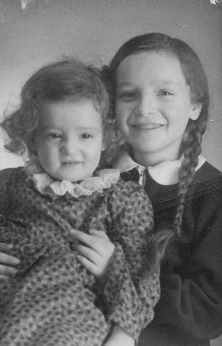 Two little girls pose for a photo