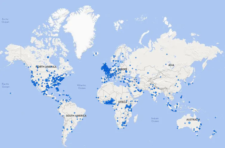 World map with blue dots.