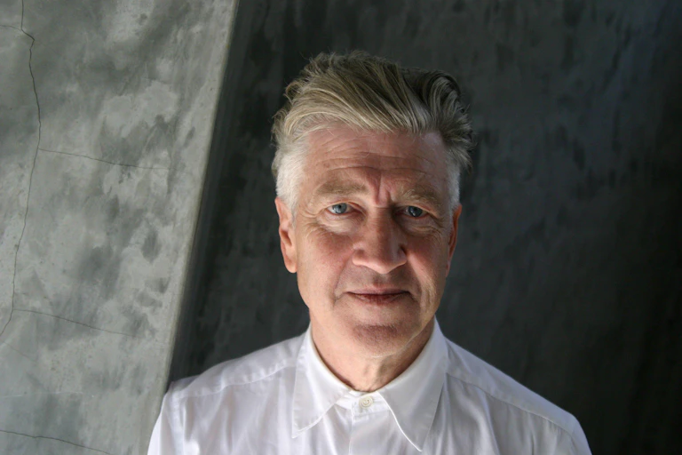 David Lynch in a white shirt.