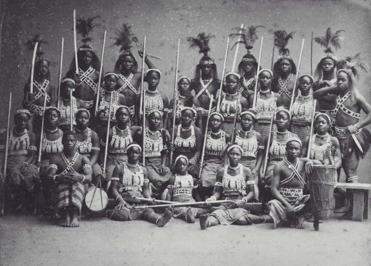 A photo of several women from Dahomey in warrior clothing.
